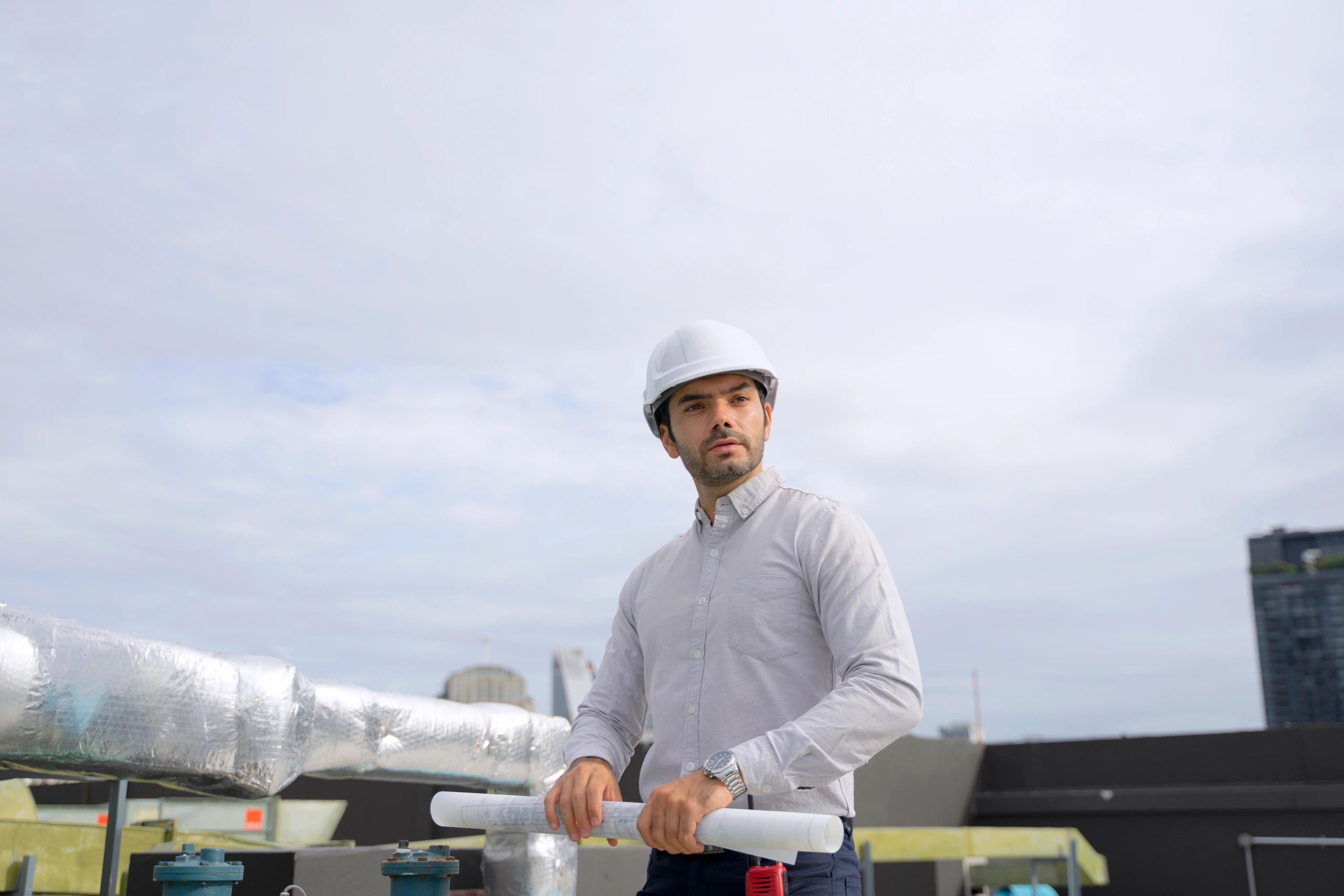 Technician working on commercial rooftop HVAC equipment